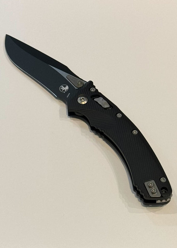 Microtech Amphibian RAM-LOK Manual Folding Knife Bohler M390MK Black SS Blade/Black Fluted G10 Handle SKU 137RL-1FL